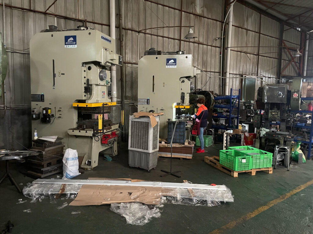 Metal stamping press machine operator Xiamen China factory