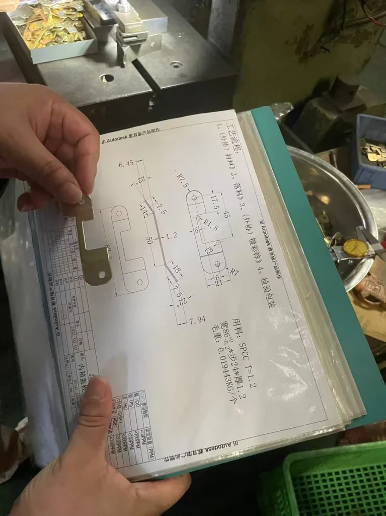 Engineering drawing with tolerance callouts for stamped steel bracket