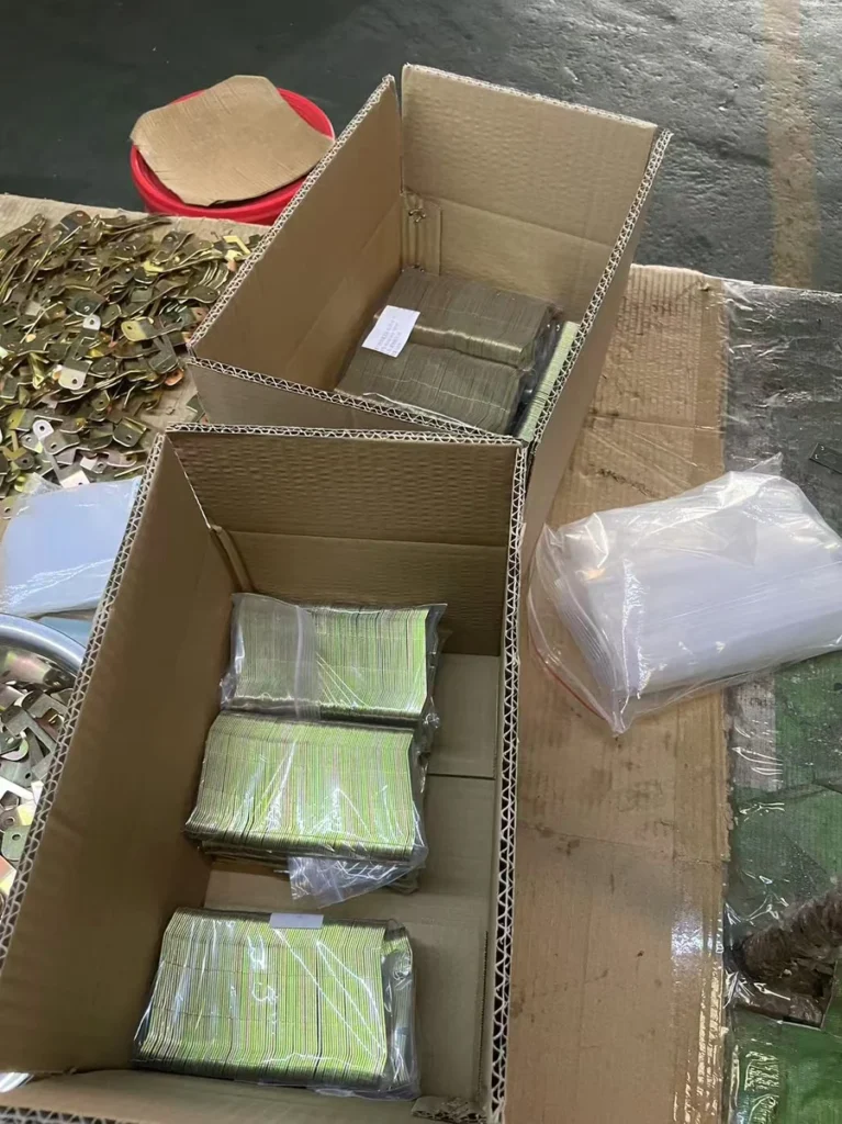 Export packaging stamped metal parts in carton boxes ready for shipment