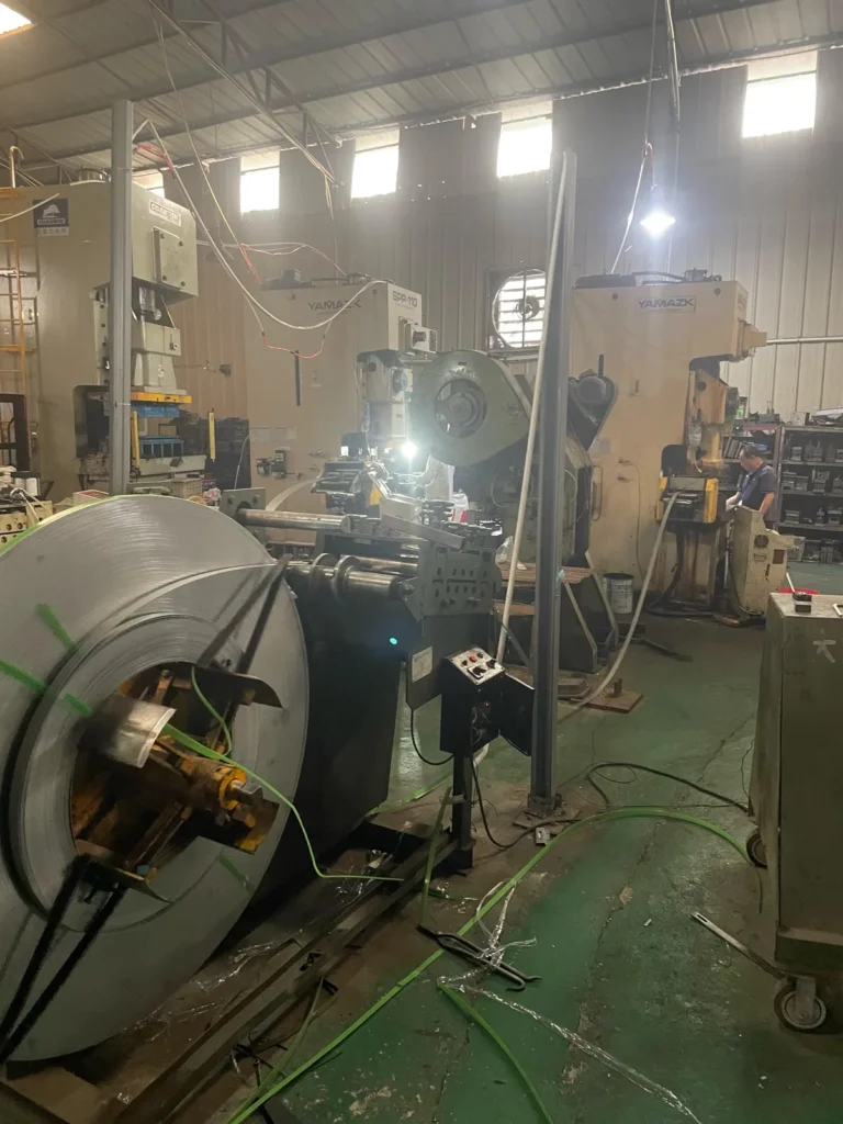Automatic coil feeder connected to YAMAZK stamping press