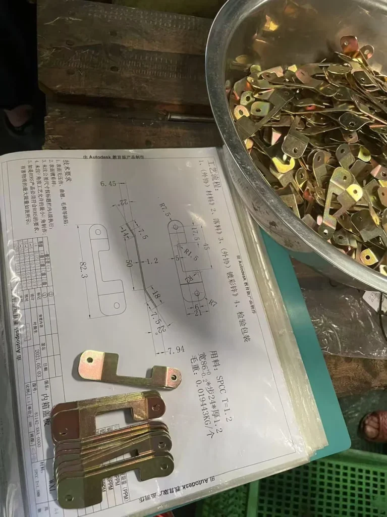 First article inspection comparing stamped part to engineering drawing