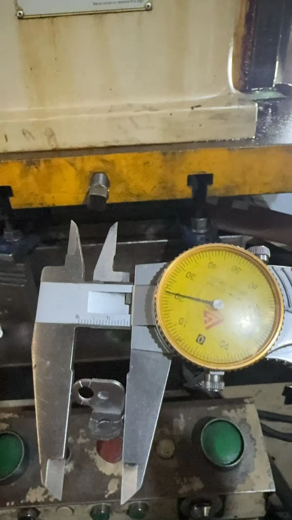 Quality inspection with vernier caliper and micrometer at metal stamping factory Xiamen
