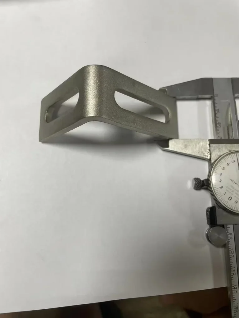 Solar mounting bracket width dimension check with dial caliper
