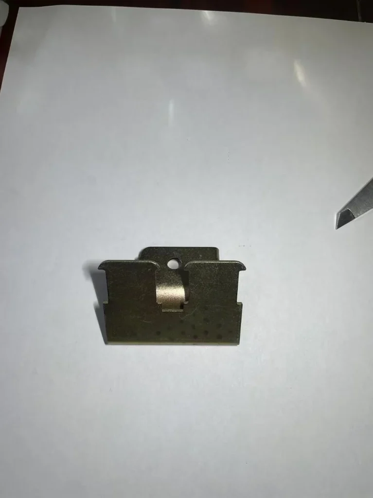 Progressive die tooling used for motorcycle bracket stamping