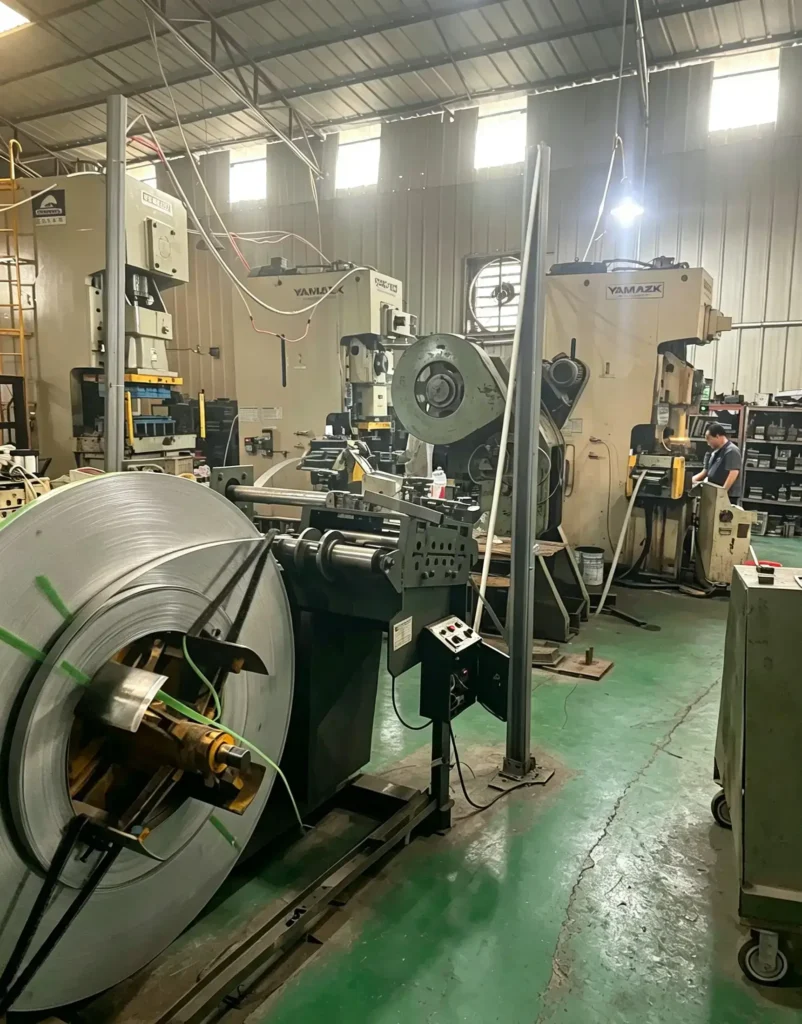 Automatic coil feeder connected to stamping press