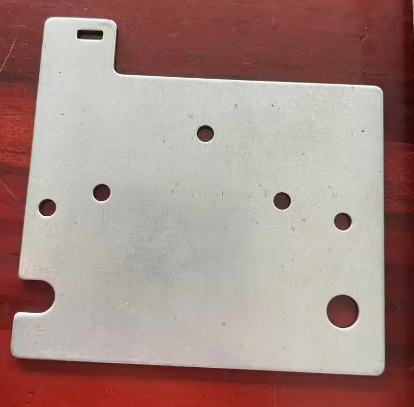 Wire-cut galvanized sheet metal component before bending